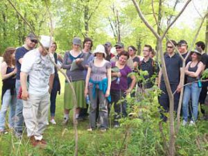 Kahnawake Faith Keeper Darrell Thomson (left, in white) shares knowledge passed down over generations while leading a Medicine Walk. / Photo courtesy of Nicole Ives