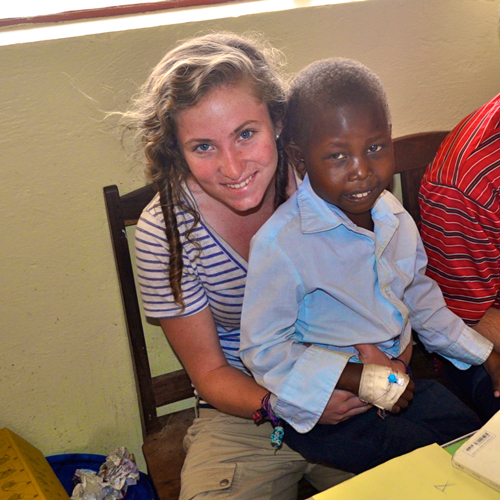 Annaliese Snodgrass and a young child she met while interning for Initiative to End Child Malnutrition in Uganda. / Photo courtesy of Annaliese Snodgrass