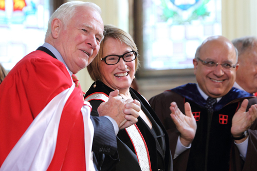 Governor General David Johnston (left) and Rector Anthony C. Masi applaud as Suzanne Fortier is officially installed as Principal and Vice-Chancellor. / Photo: Owen Egan