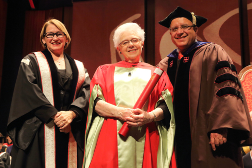 Physiology professor Ann Wechsler, accepts the McGill University Lifetime Achievement Award for Leadership in Learning from Principal Suzanne Fortier and Provost Anthony Masi. / Photo: Owen Egan