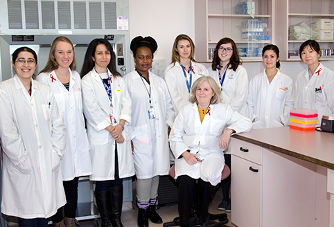 Dr. Nicole Bernard (sitting) and her team from the HIV and Innate Immunity Research Laboratory.