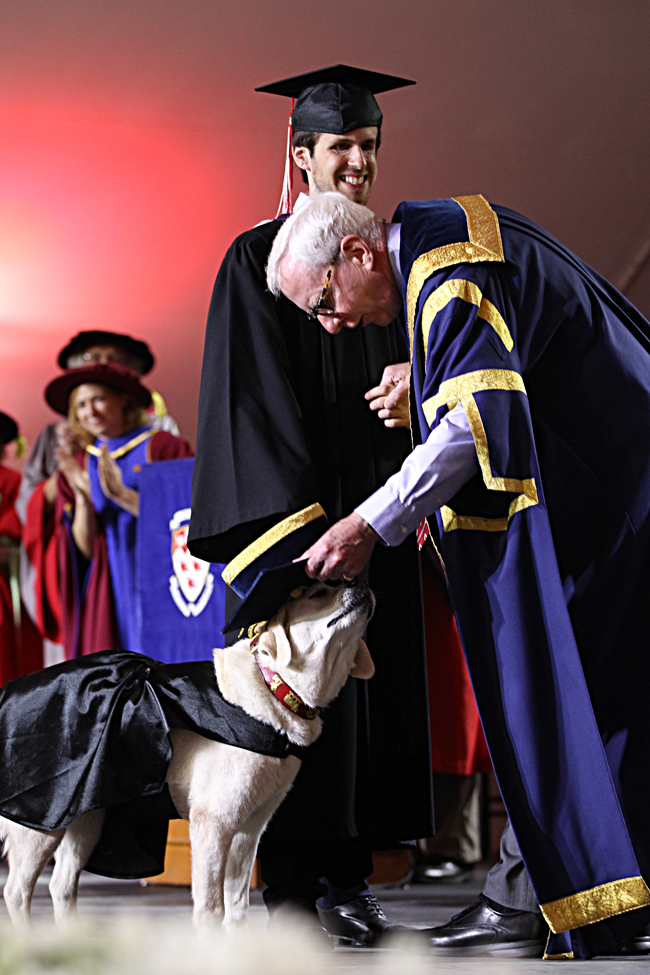 Thibault Trancart is all smiles as Kip Cobbett, Chairmanof McGill's BOG gives Fiona the traditional tap with his cap. / Photo: Owen Egan