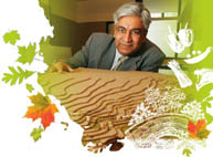 Urban planning professor Vikram Bhatt with a topographical model of an area outside of Kampala, Uganda, where he is working with the local government to plan a new settlement that will incorporate urban agriculture