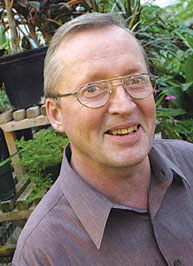 Alan Watson searches for insects and plants that selectively prey on destructive agricutural parasites. Credit: Owen Egan