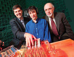 Avrum Hollinger (middle), a graduate student in Marcelo Wanderley's (left) electrical engineering lab, built a metal-free keyboard that can be played inside a highly magnetic MRI machine. The special instrument now makes it possible for neuroscientist Robert Zatorre (right) to monitor musicians' brain activity while they play.