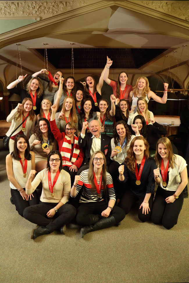 Principal Suzanne Fortier and then-Chancellor Arnold Steinberg celebrate a golden year for the McGill Martlets hockey team in 2014. / Photo: Owen Egan