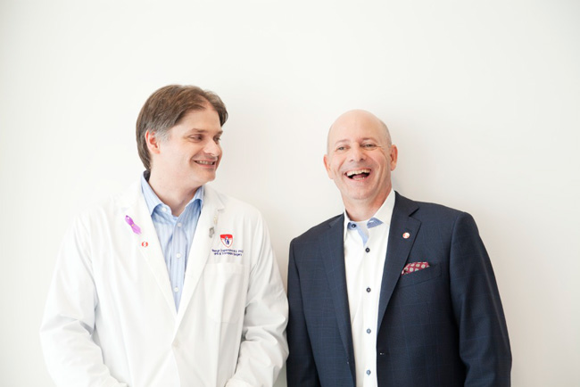 Dr. Georges Zogopoulos (left) and Serges Bériault share a happy moment. / Photo: Rachel Côté Photographer and to the Cancer Research Society   