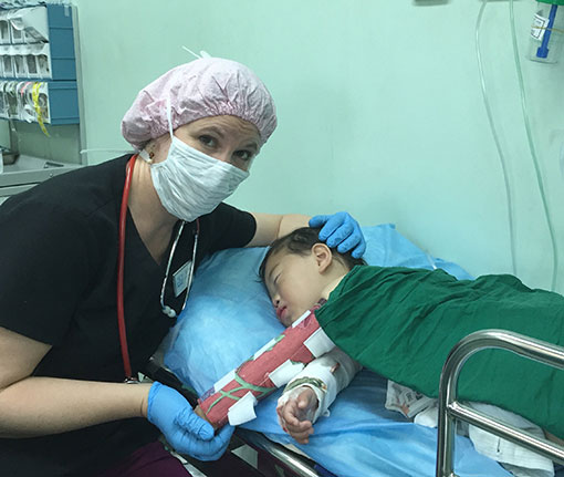 Julie Sparkes with a young patient in China.