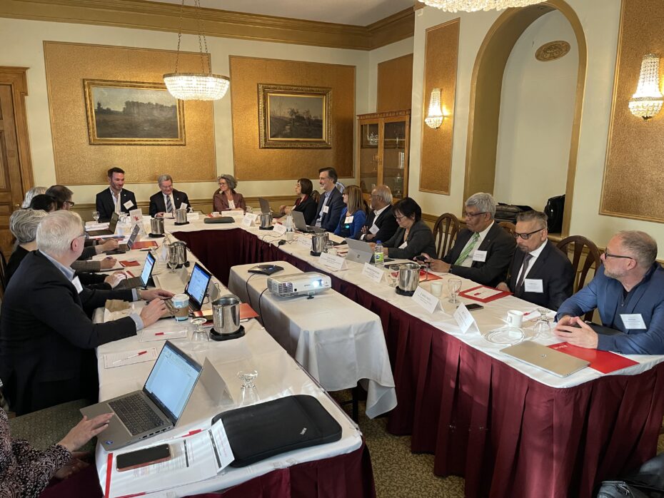 People seated at a meeting table