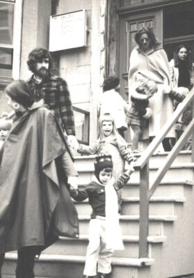 Parents and children descending the steps of the McGill daycare