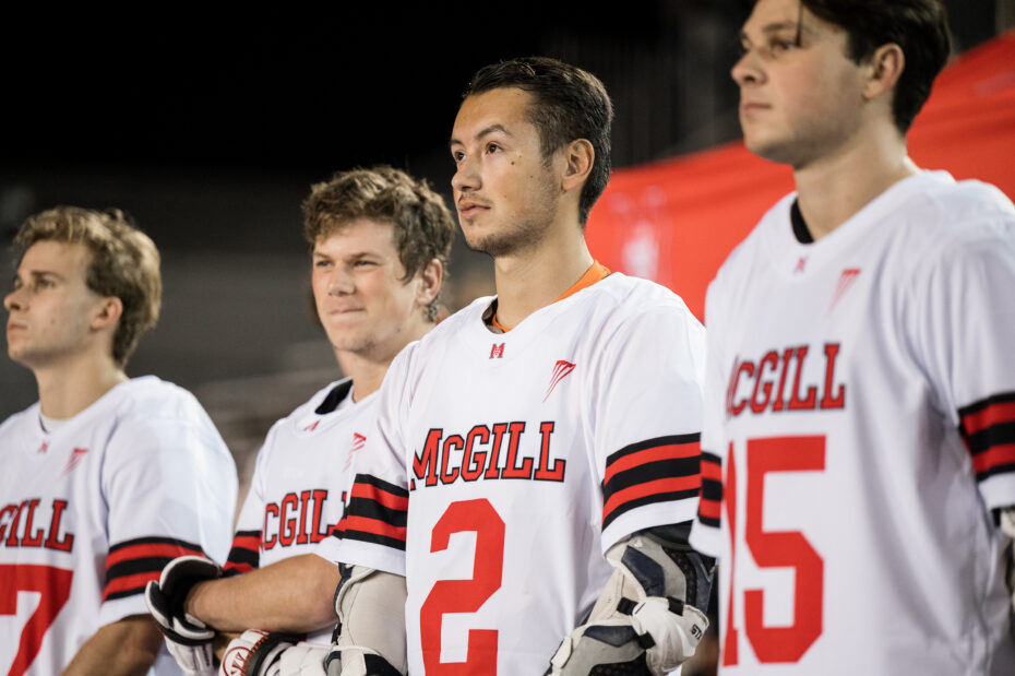 Four student athletes standing in a row, wearing McGill jerseys