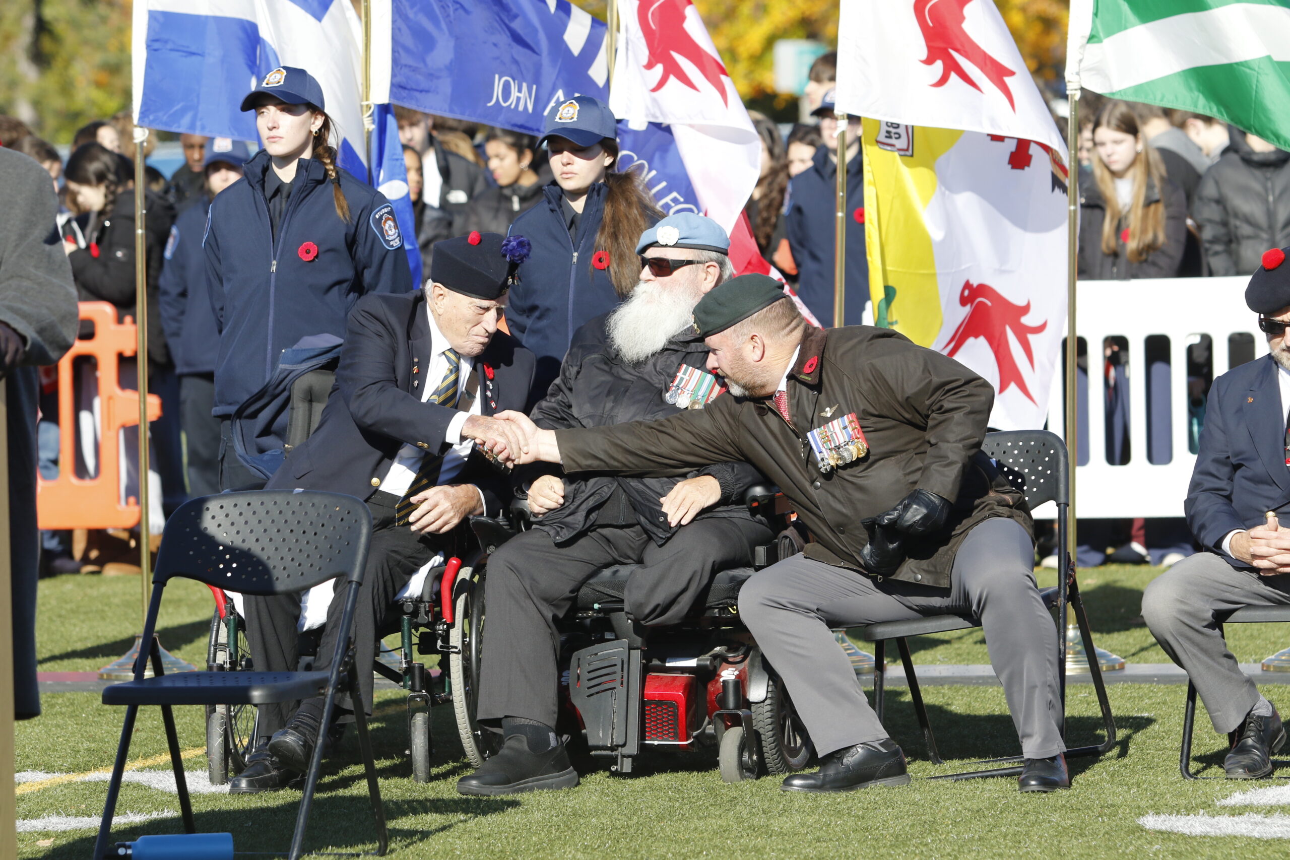 WW II veteran Joe Maxwell shakes hands with Colonel Andrew Lussier