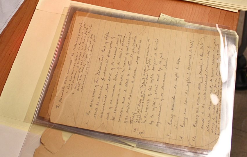 An aged paper with handwritten cursive text