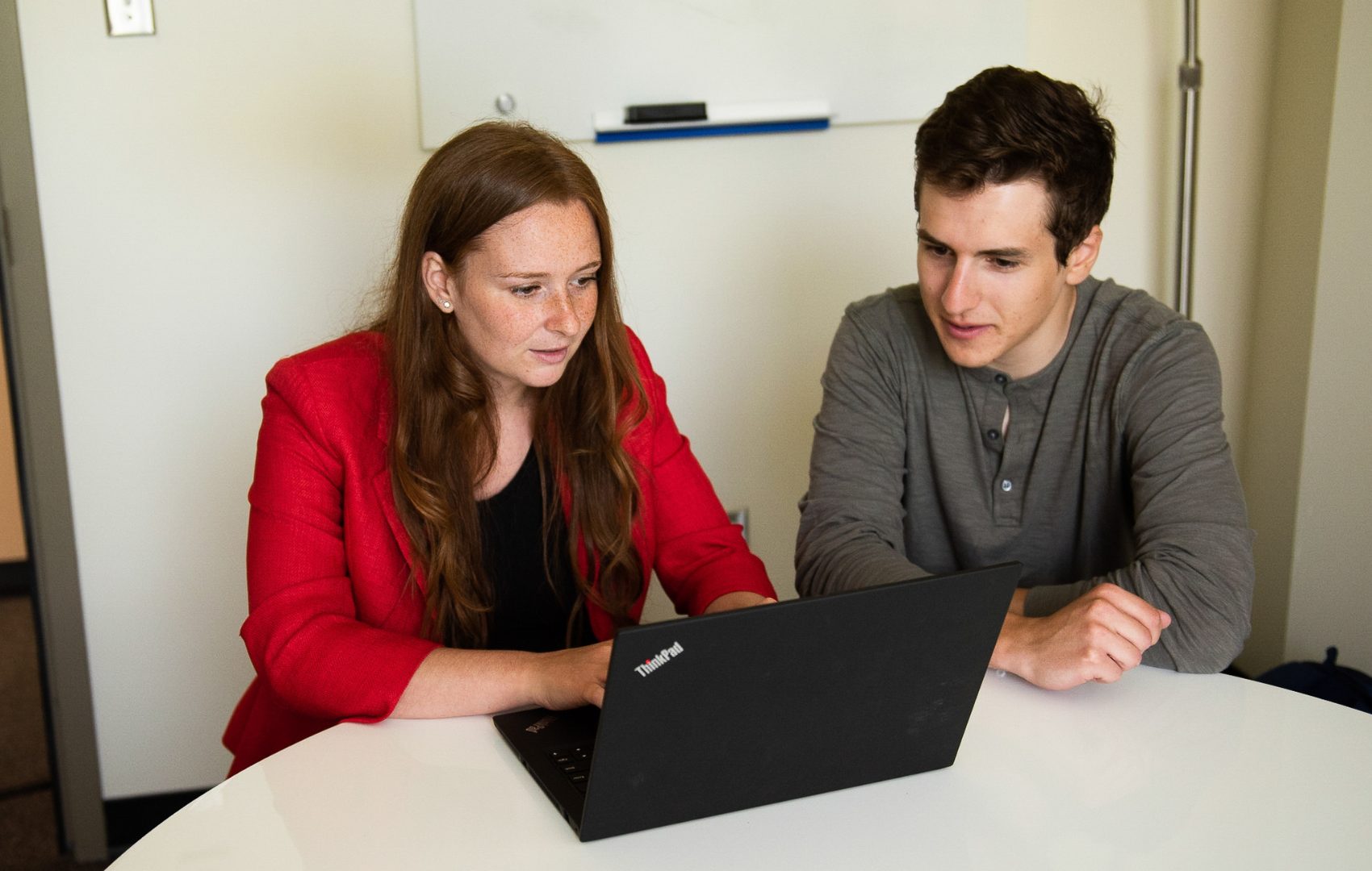 Two McGillians working on a laptop