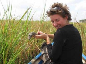 Jenna Senecal holds a dead baby crocodile while visiting Liwonde National Park, Malawi. / Photo courtesy of Jenna Senecal