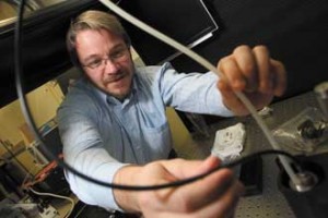 Prof. Sylvain Coulombe prepares the Atmospheric Pressure Glow Discharge torch for a surface functionalization experiment. / Photo: Owen Egan