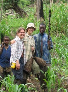 Local fishermen (far left and far right) with their hand-made fish traps and nsonzi (catfish) catch. Also in this photo: Erika Crispo, middle right; Diana Sharpe, middle left. / Photo: Jaclyn Paterson