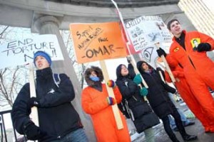From left to right: McGill students Evan Tutton, Karen Schousboe, Celeste Pang, Margoth Rico and Augustin Chabrol braved the cold on Jan. 27 to show their support for Omar Khadr, currently incarcerated in Guantanamo Bay. / Photo: Owen Egan