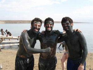 From left to right: B’Comm students Jake Leibner, Daniel Brenhouse and John Matheson cake themselves in the soothing mud from the Dead Sea.