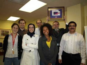 Members of the Rak lab (left to right): Dr. Delphine Garnier, Alexander Dombrovsky, Maryam Hashemi, Briam meecham, Nathalie Magnus, Dr. Janusz Rak (holding plaque) nd Dr. Khalid Al Nedawi. / Photo courtesy Montreal Children's Hospital