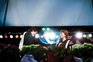 Sam Donato, a BSc graduate with Honours in Microbiology and Immunology, gets the traditional tap from Principal Heather Munroe-Blum’s cap during convocation – a ritual reserved for students receiving their first degree. / Photo: Claudio Calligaris