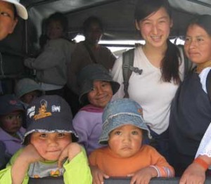 Andrea Evans in the back of a truck with children and mothers of Chilcapamba, Ecuador. / Photo courtesy of Andrea Evans.