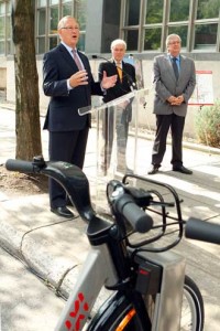 Montreal Mayor Gérald Tremblay announces creation of a new bicycle path as François R. Roy, Vice-Principal (Administration and Finance) and André Lavallée, Vice-Chairman of the Executive Committee look on. / PHOTO: Owen Egan