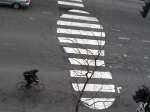 With his urban art, Peter "Roadsworth" Gibson tries to add a little life to the city's otherwise cold and grey landscape. Here, he gets creative with a common crosswalk. Photo courtesy of Roadsworth.