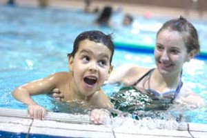 Five-year-old Zakaria Tou enjoys some pool time with McGill Physiology undergrad and Making Waves instructor, Laura Machan. / PHOTO: Michael Garfinkle