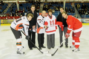 UQTR Rector Ghislain Bourque and McGill Principal Heather Munroe-Blum (sporting their respective team jerseys), presided over the ceremonial opening faceoff at the game between the UQTR Patriotes and the visiting McGill Redmen at Le Colisée in Trois-Rivières Friday night. / Photo courtesy UQTR